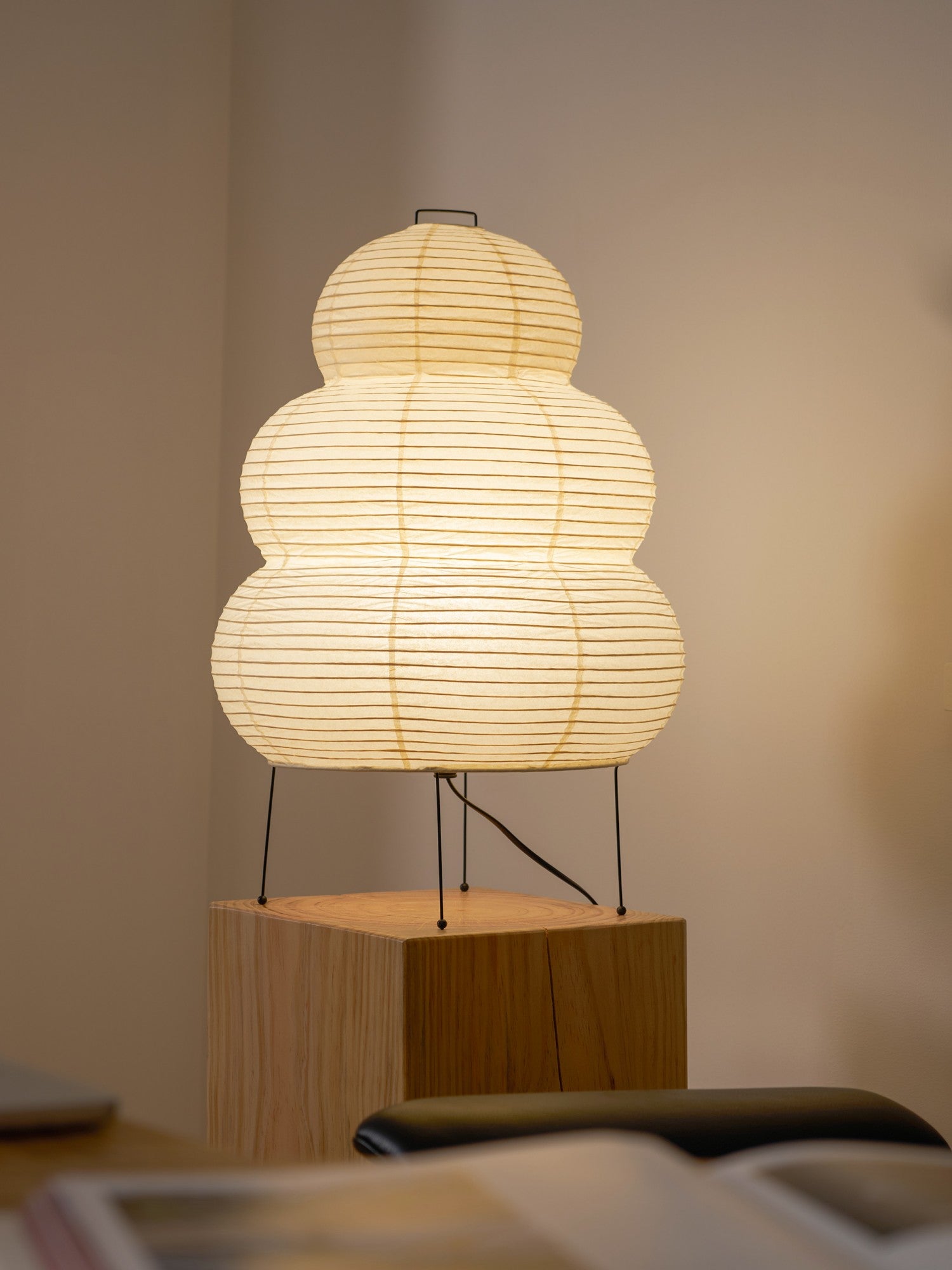 Contemporary tiered paper lamp design, functional sculptural lighting artwork piece