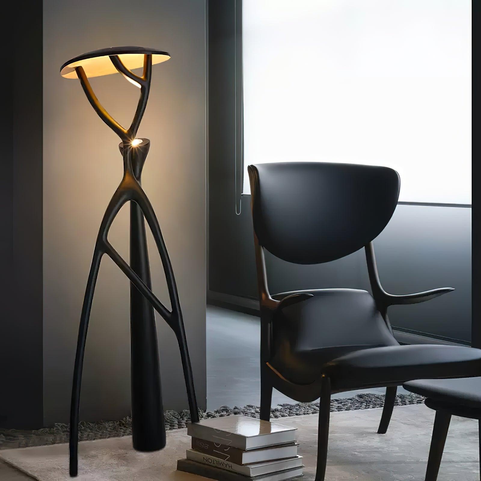 Blonski sculptural floor lamp front view in minimalist lounge area, warm top lighting modern interior