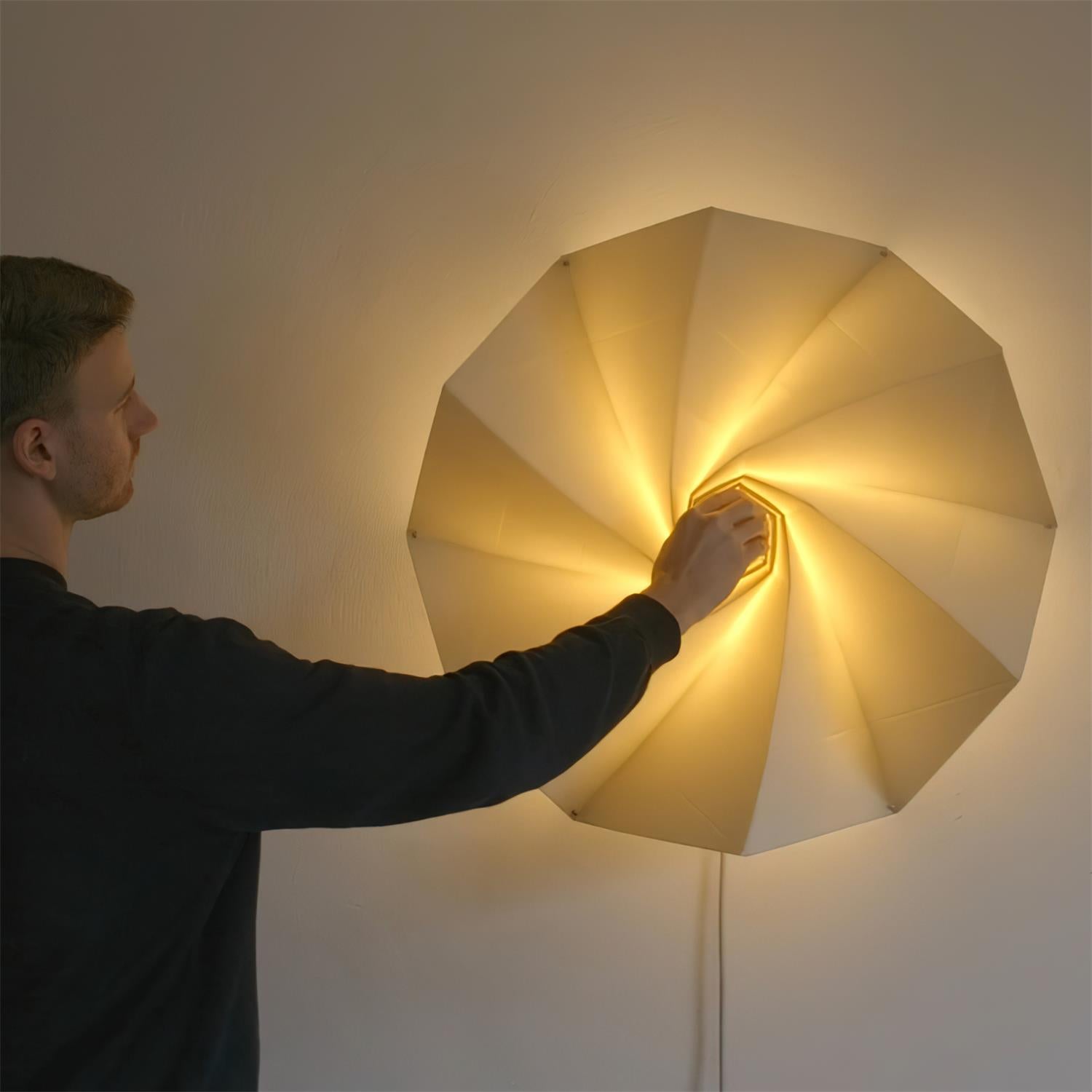 Bloom adjustable wall sconce in contemporary interior setting with neutral tones and architectural interest
