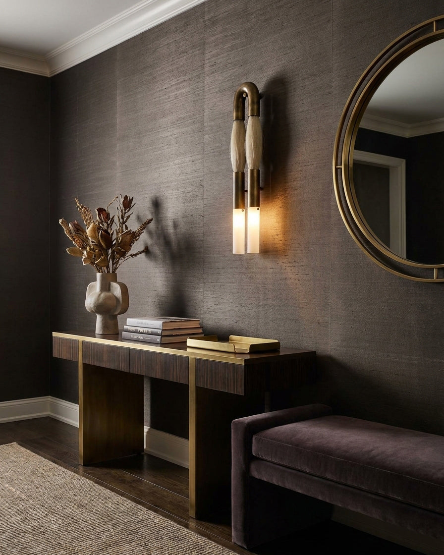 Branwick wall sconce in black finish demonstrating contemporary modern design with textured horsehair and brass hardware details