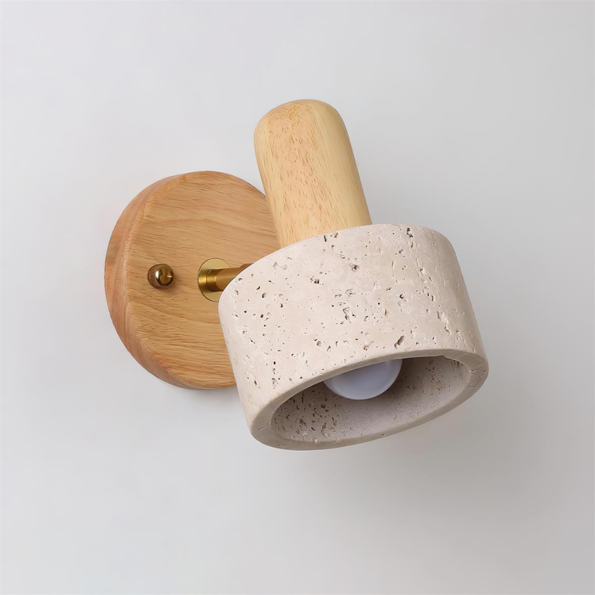 Travertine wall sconce styled with contemporary art and gallery wall for modern interior design