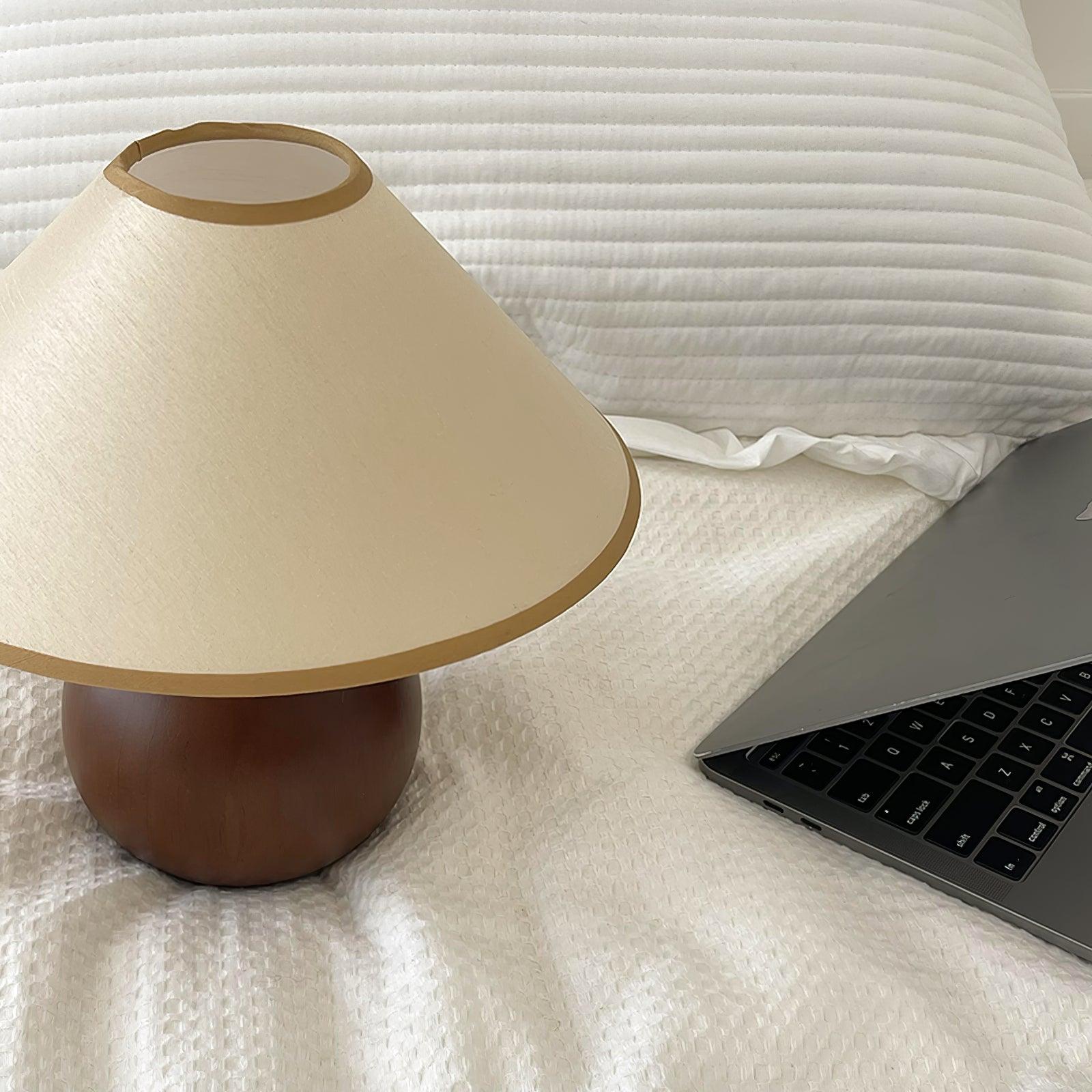 Modern table lamp with wooden spherical base, mid-century design principles and styling