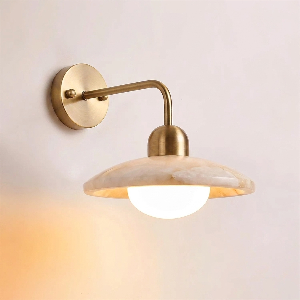 Carolia alabaster wall sconce side close-up illuminated with warm soft glow and opal glass diffuser