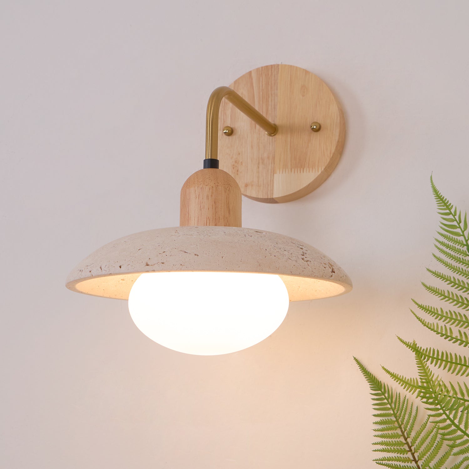 Carolia travertine wall lamp with walnut wood base creating warm sophisticated ambient lighting accent