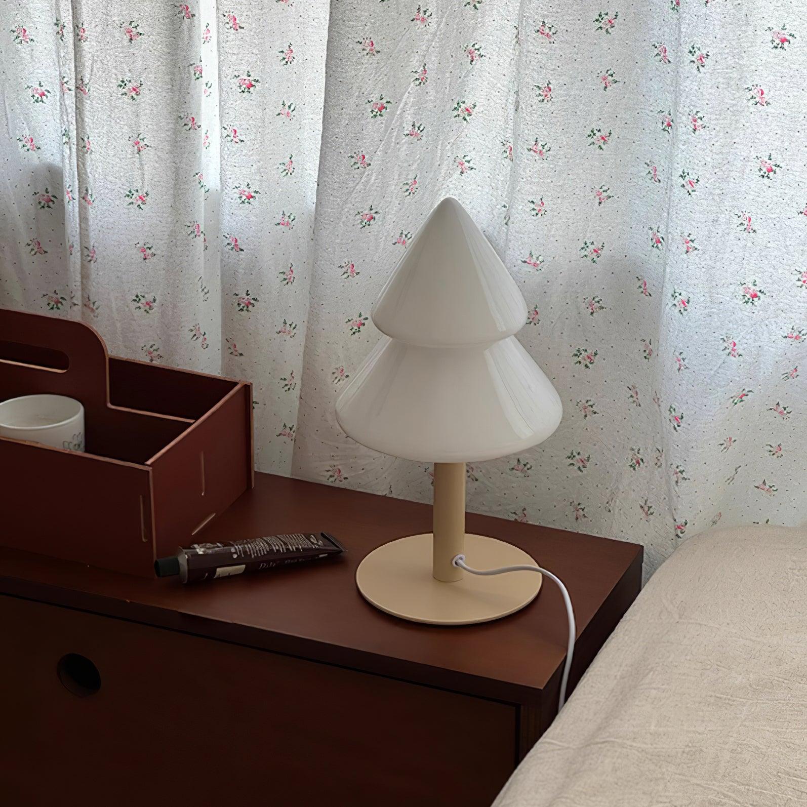 Multiple color options of modern Christmas tree table lamp displayed side by side