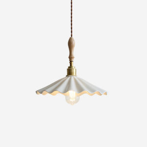 Daisy ripple ceramic pendant lamp close-up showing scalloped white shade with rippled detailing and exposed brass hardware