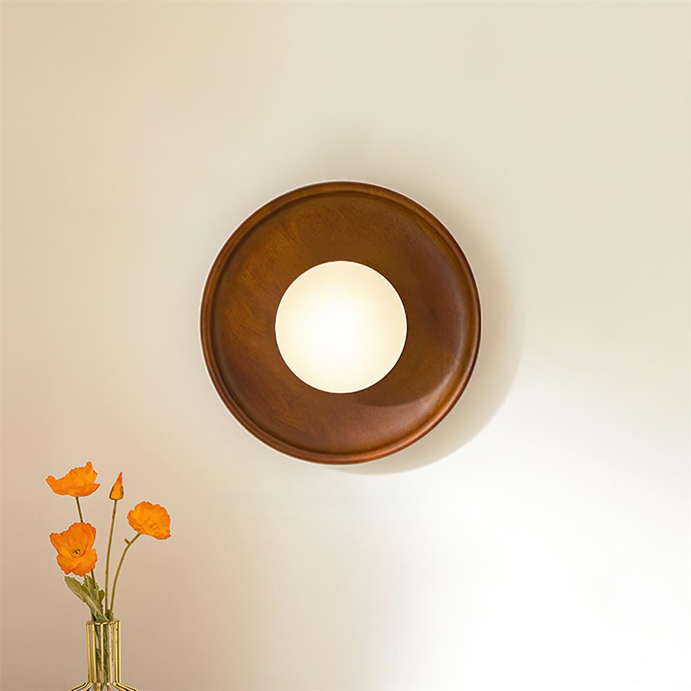 Walnut color round wall sconce paired installation beside bathroom mirror