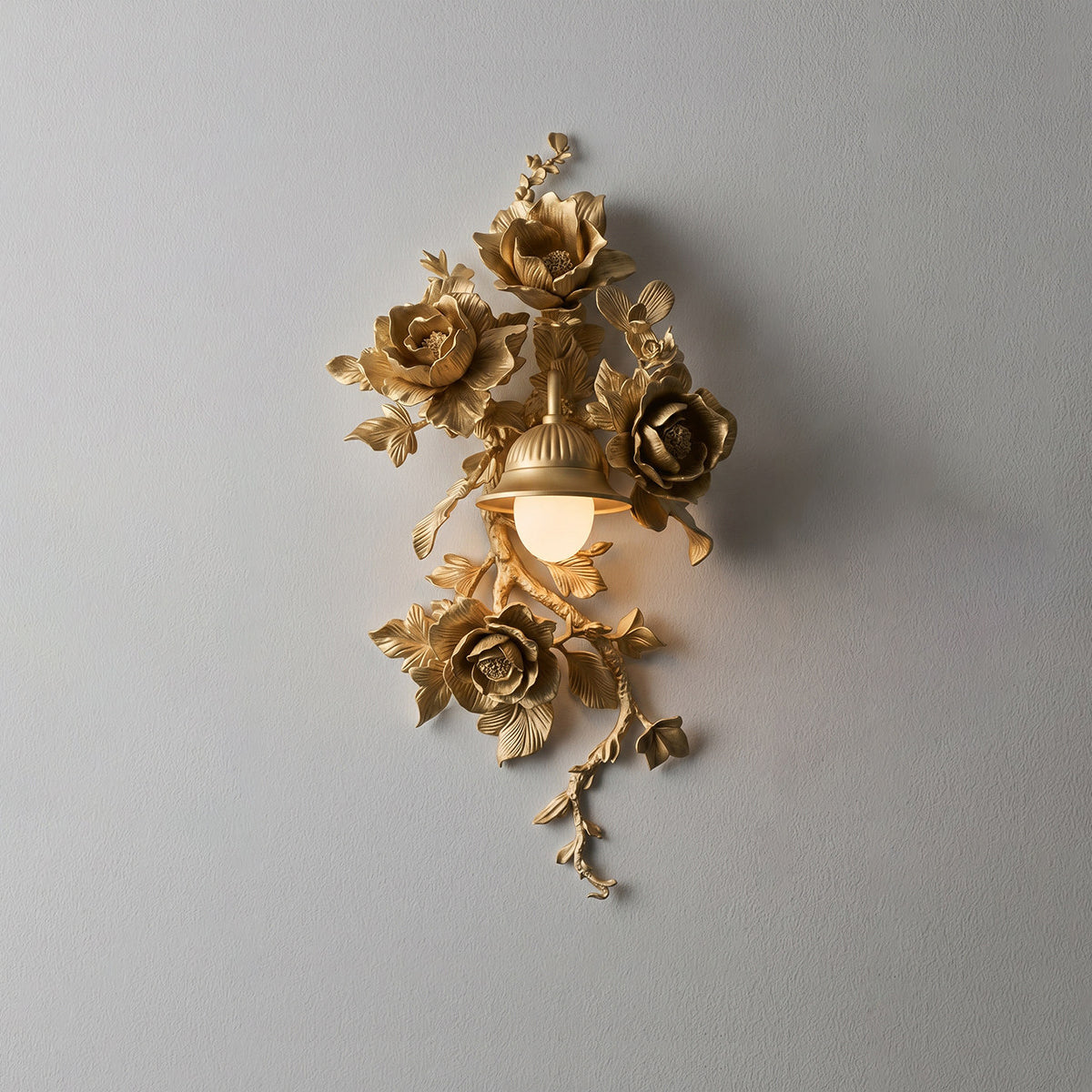Gold Elysia Bloom sculptural rose wall sconce studio flatlay, detailed view of hand-carved metal rose vines and branch