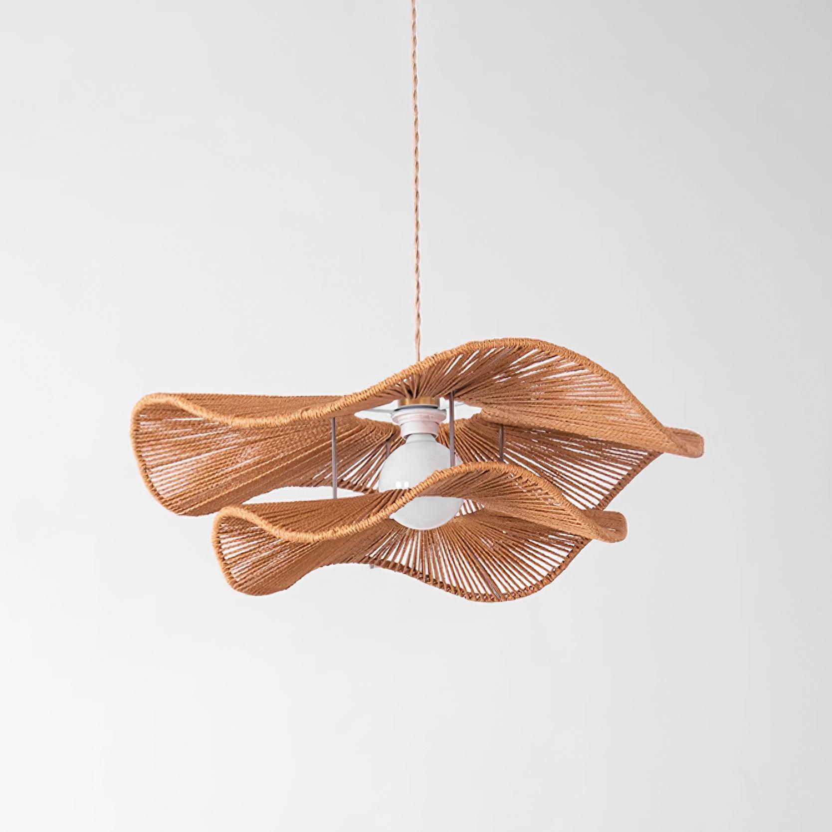 Gunilla hemp rope pendant light installation detail showing fixture attachment and ambient room lighting effect