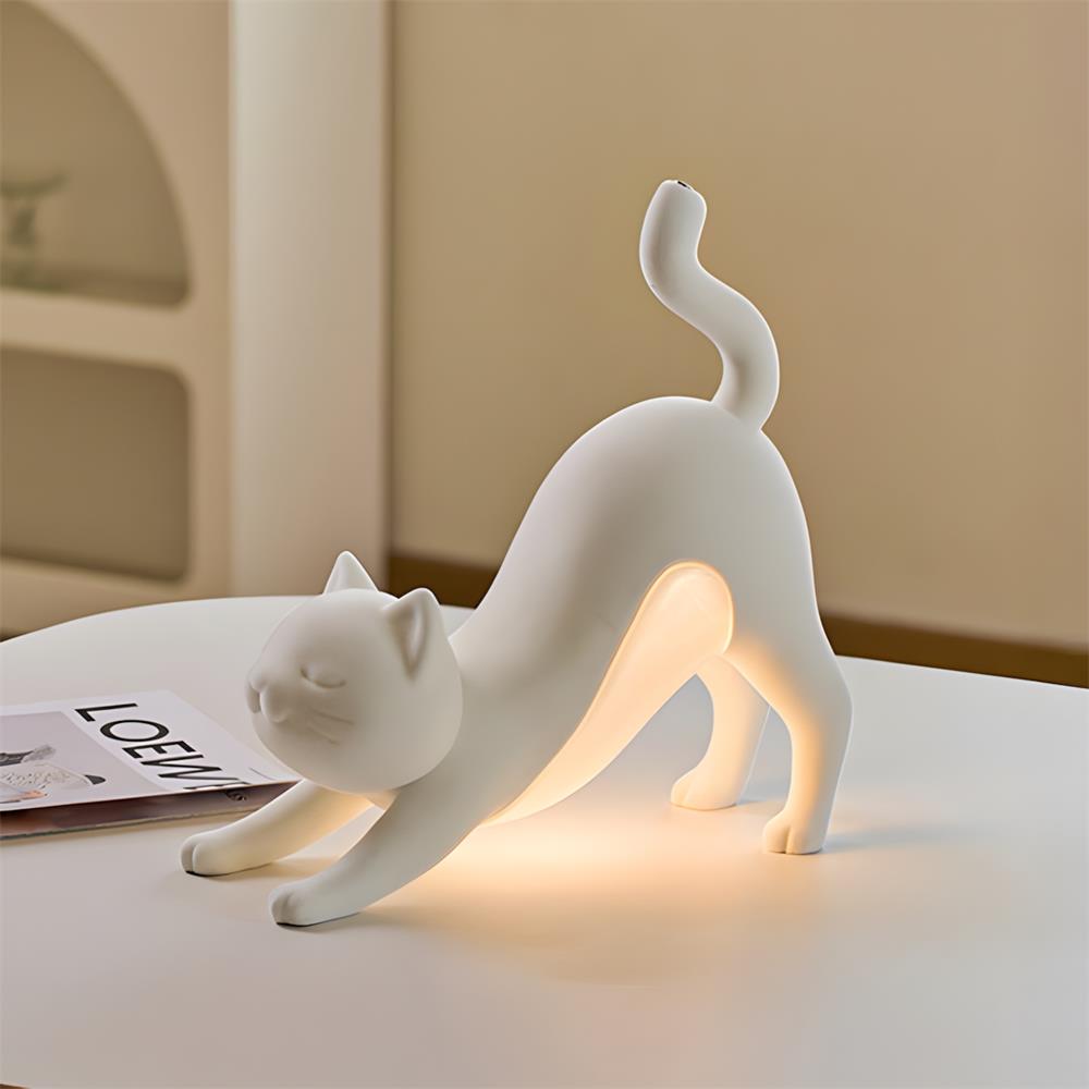 White stretching cat lamp with smooth matte resin finish and artistic silhouette