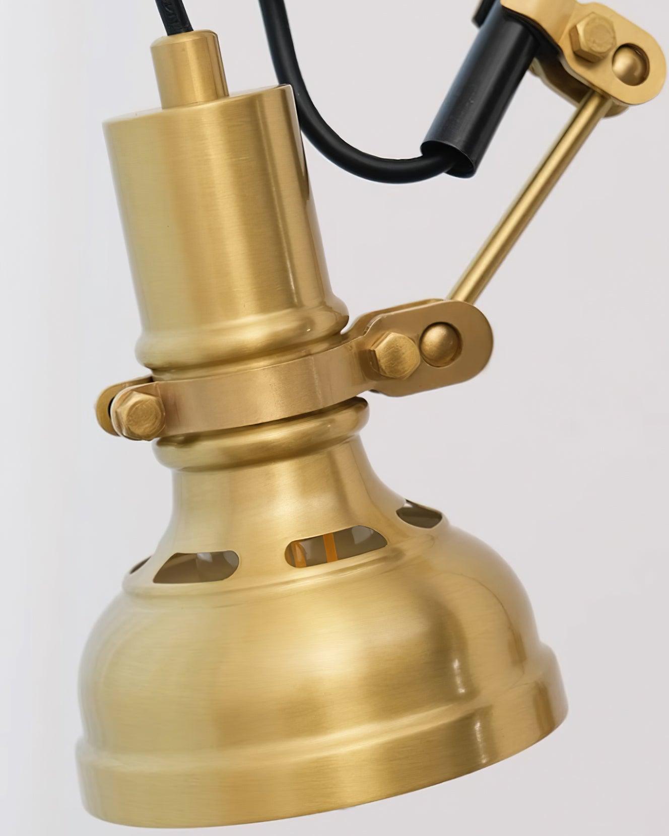 Kane wall lamp head detail close-up showing brushed brass finish and vented lampshade