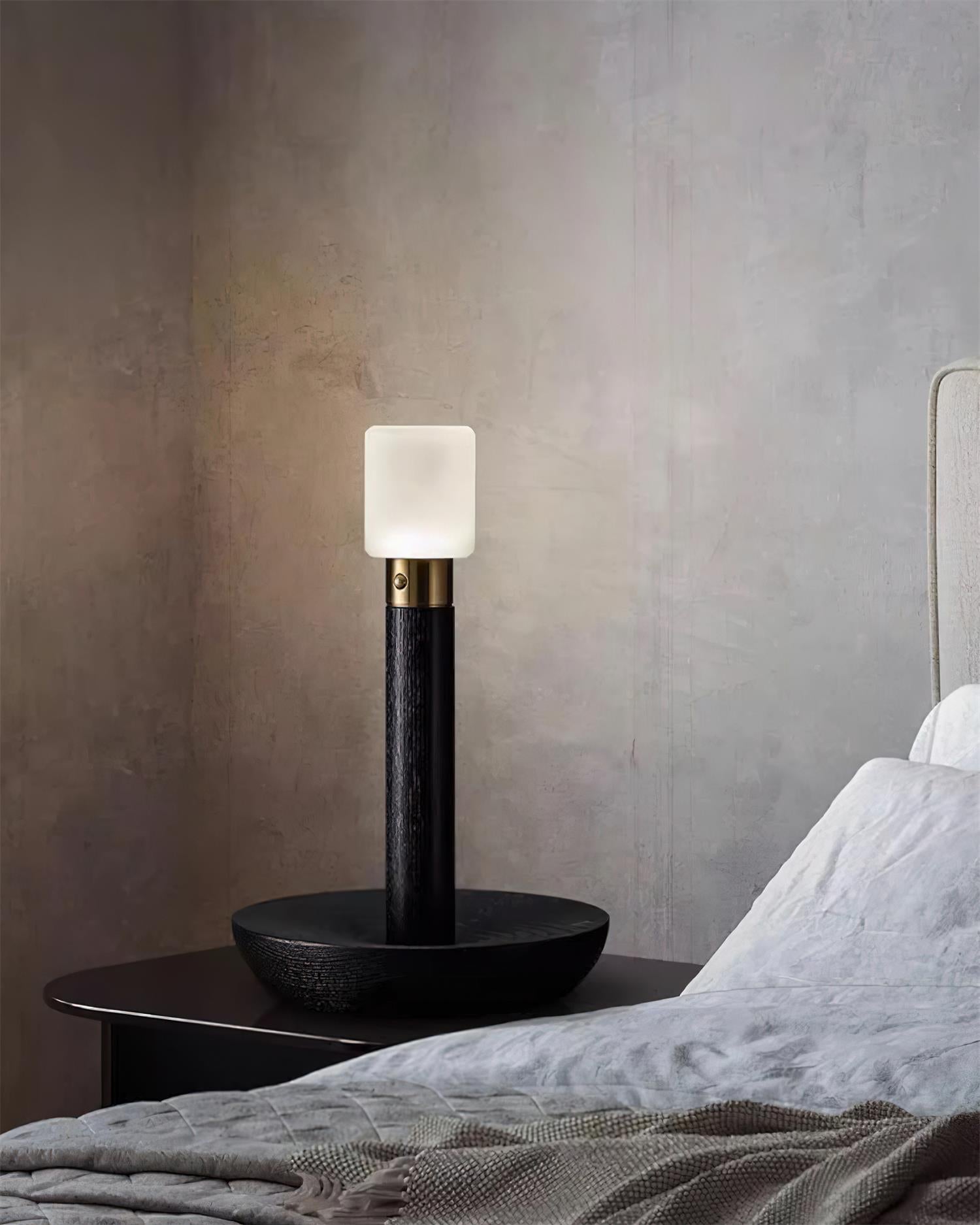 Removable frosted acrylic shade of wooden table lamp demonstrating portable detachable design versatility