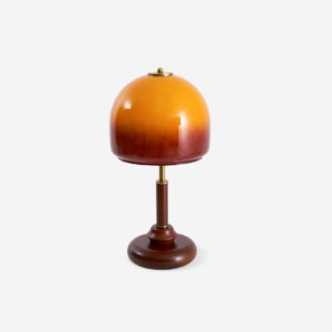 Luciano amber dome table lamp with walnut wood base and polished metal column, studio white background, front view