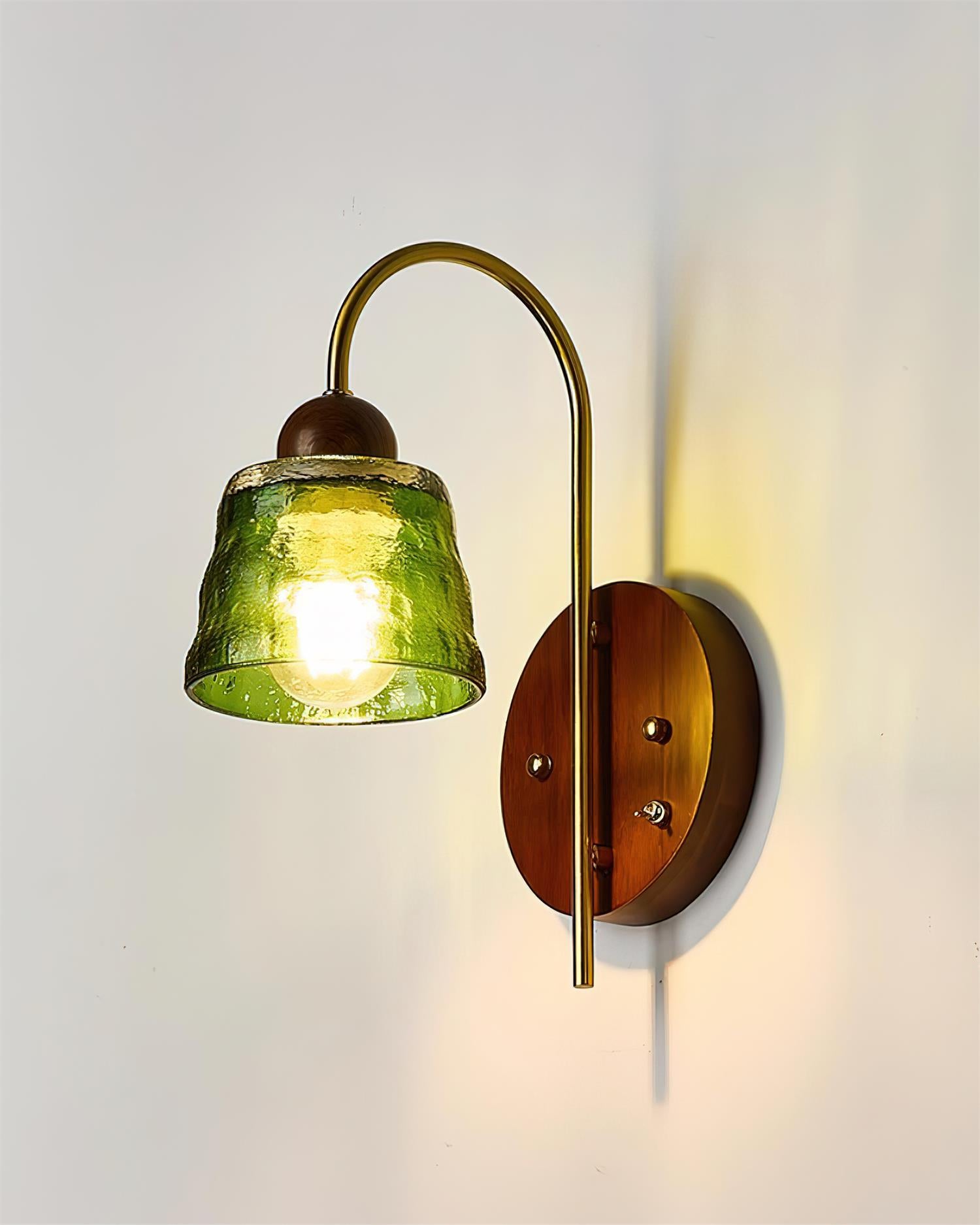 Lysora green glass wall sconce, illuminated hammered texture, brass hardware, rustic vintage style