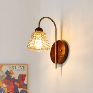 Lysora wall sconce installed above console table, ambient amber glass, interior home lighting design