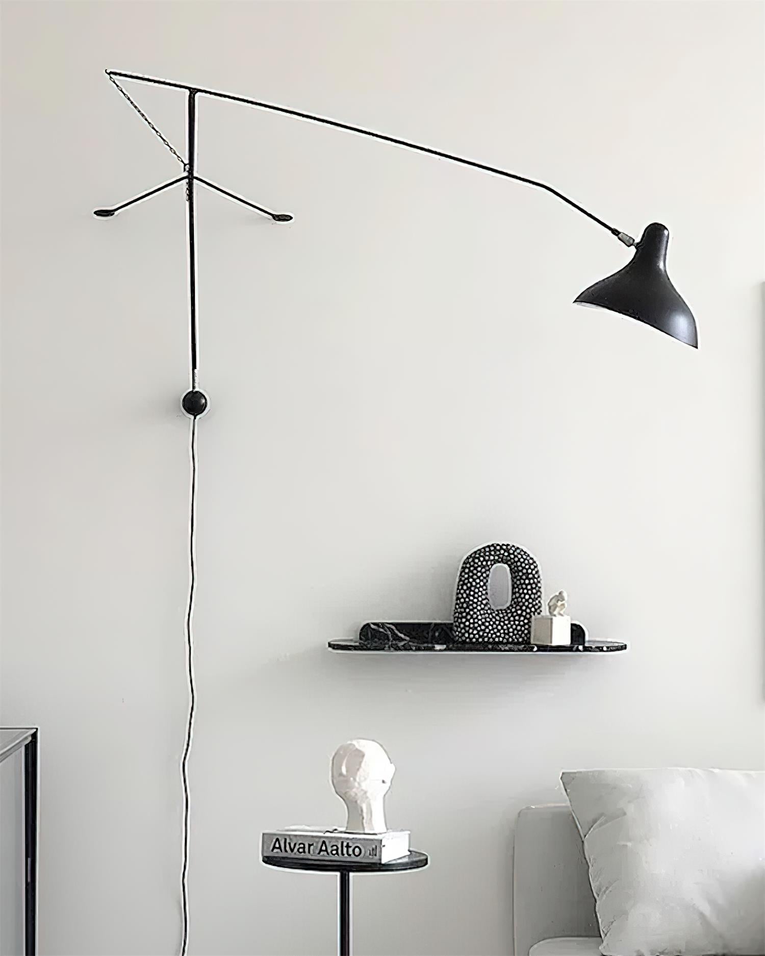 Black swing arm wall lamp sculptural design minimalist aesthetic