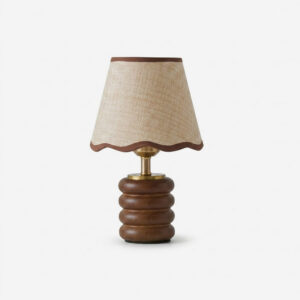 Marlowe walnut table lamp with stacked wood base and raffia fabric scalloped shade on white background, front view
