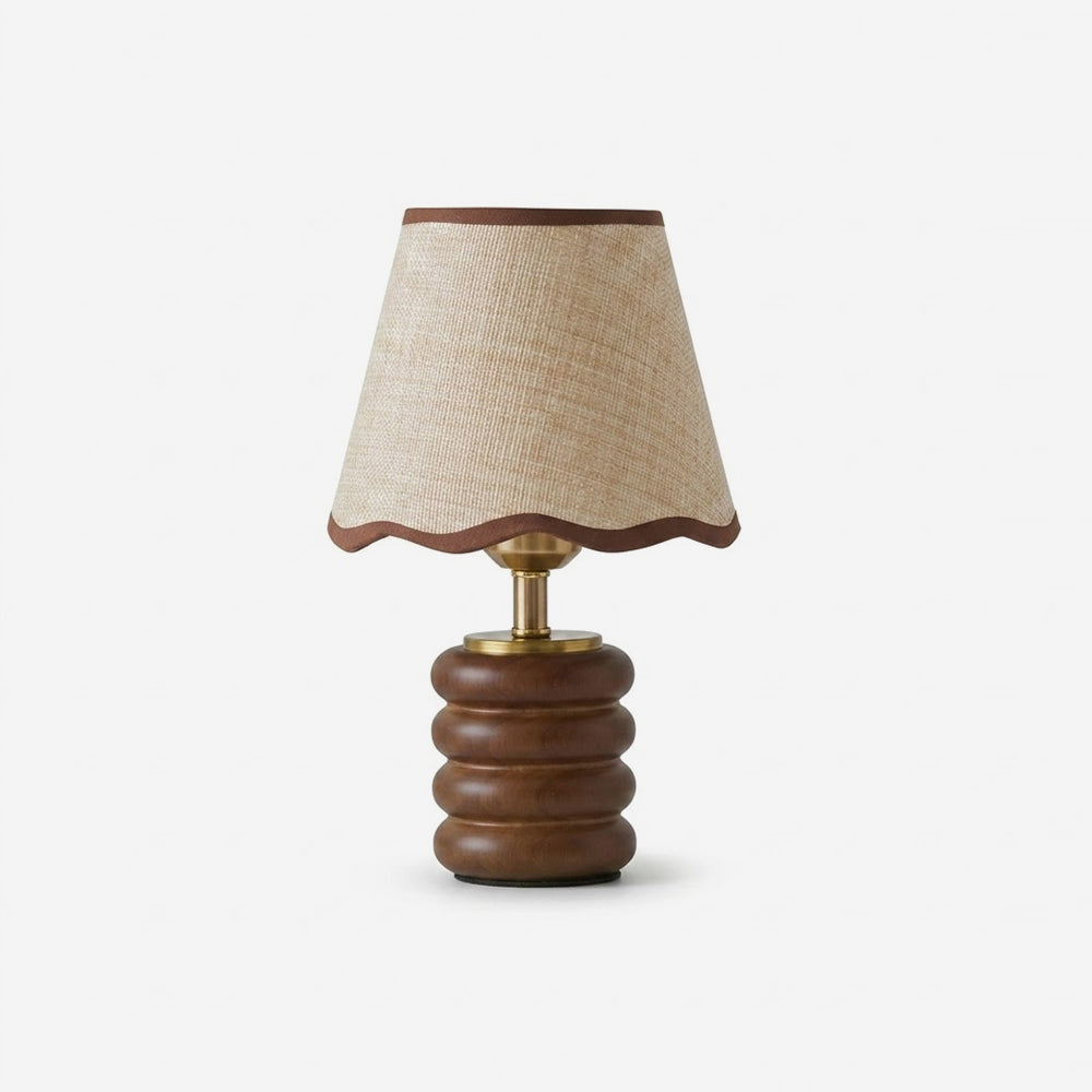 Marlowe walnut table lamp with stacked wood base and raffia fabric scalloped shade on white background, front view