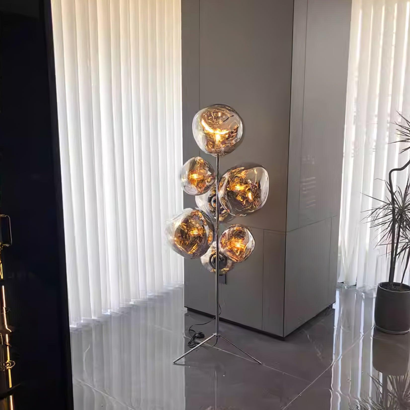 Silver bubble floor lamp with chrome base in bright white contemporary living room
