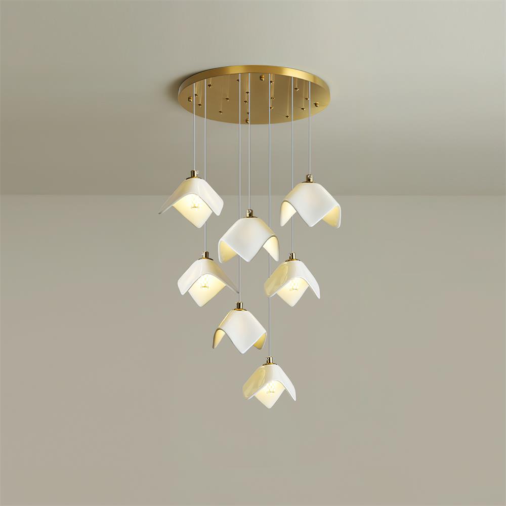 Cascading bloom chandelier installed above staircase showing warm light distribution through cascading tiers