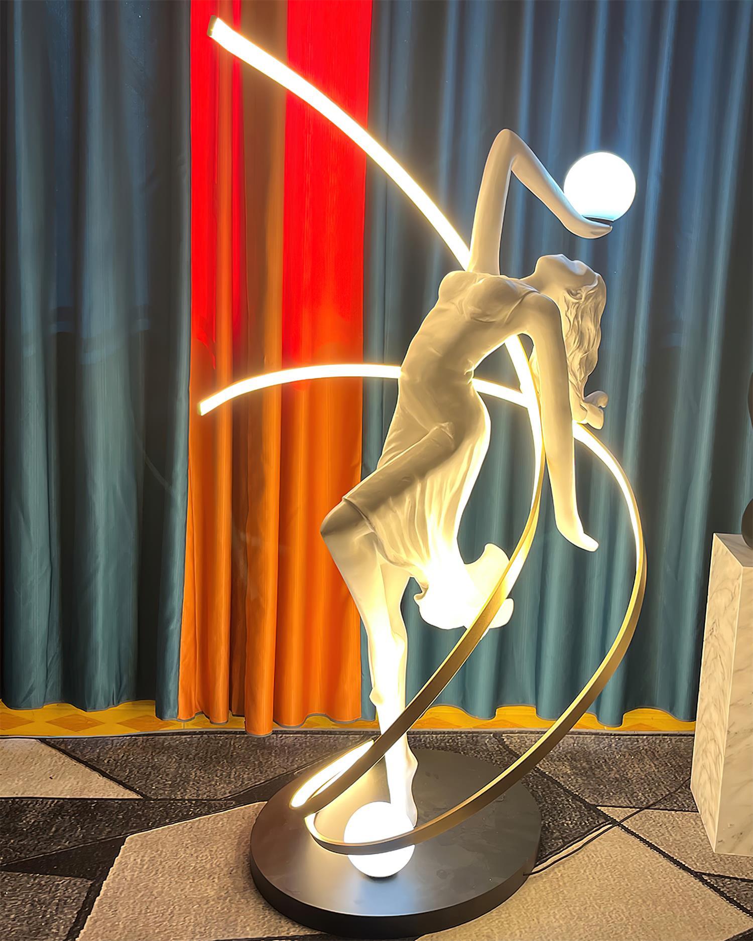 Goddess floor lamp complete composition showing divine sculpture silhouette and warm luminous glow