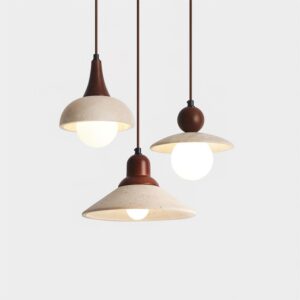 Three-shade travertine stone pendant lamp collection flat lay with dark brown metal accents and lit warm bulbs