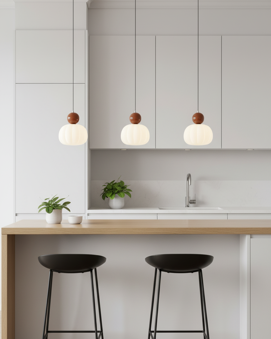 Modern pendant light with dark brown finish installed over kitchen breakfast bar - contemporary kitchen counter lighting