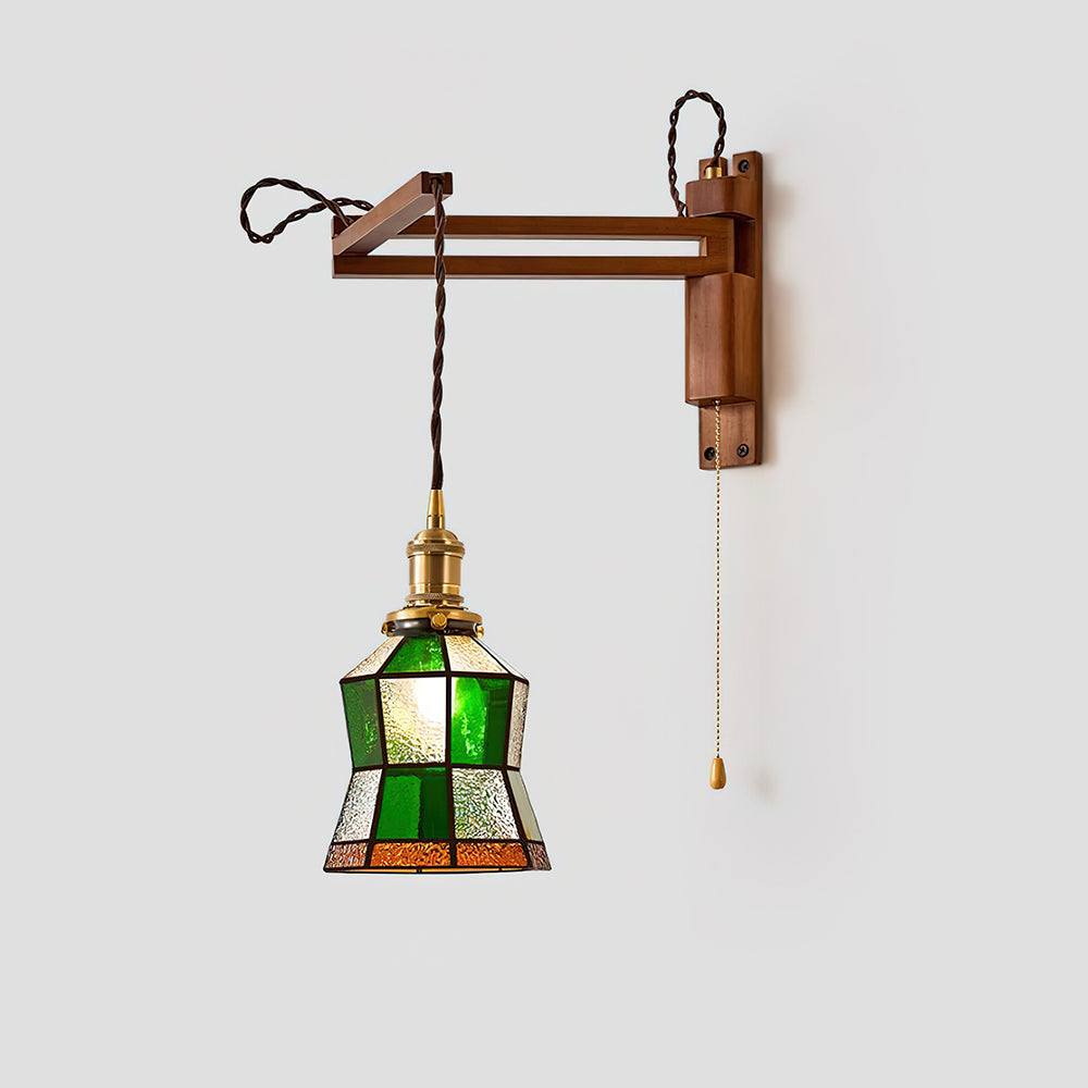 Damp-rated stained glass wall sconce installed in modern bathroom with neutral tile background, providing spa-like ambient lighting in moisture-rich environment