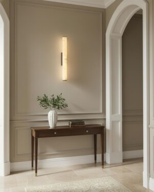Modern alabaster wall sconce in residential entryway warm ambient lighting
