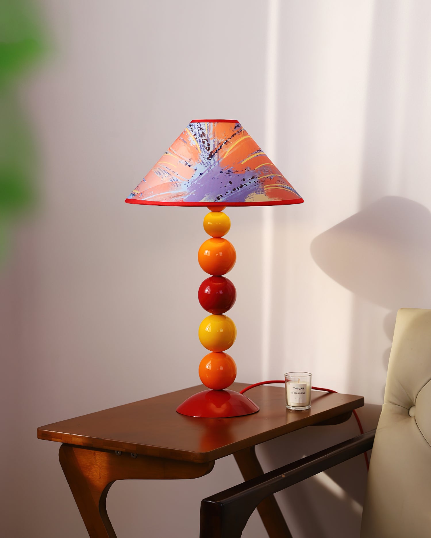 Colorful artistic table lamp featuring hand-printed pattern lampshade on stacked metal base - bohemian interior accent