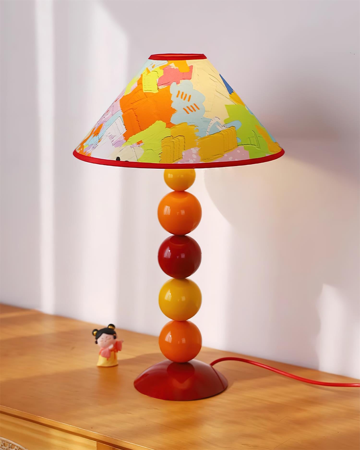 Modern table lamp with warm color palette and spherical stacked construction - playful retro decorative home fixture