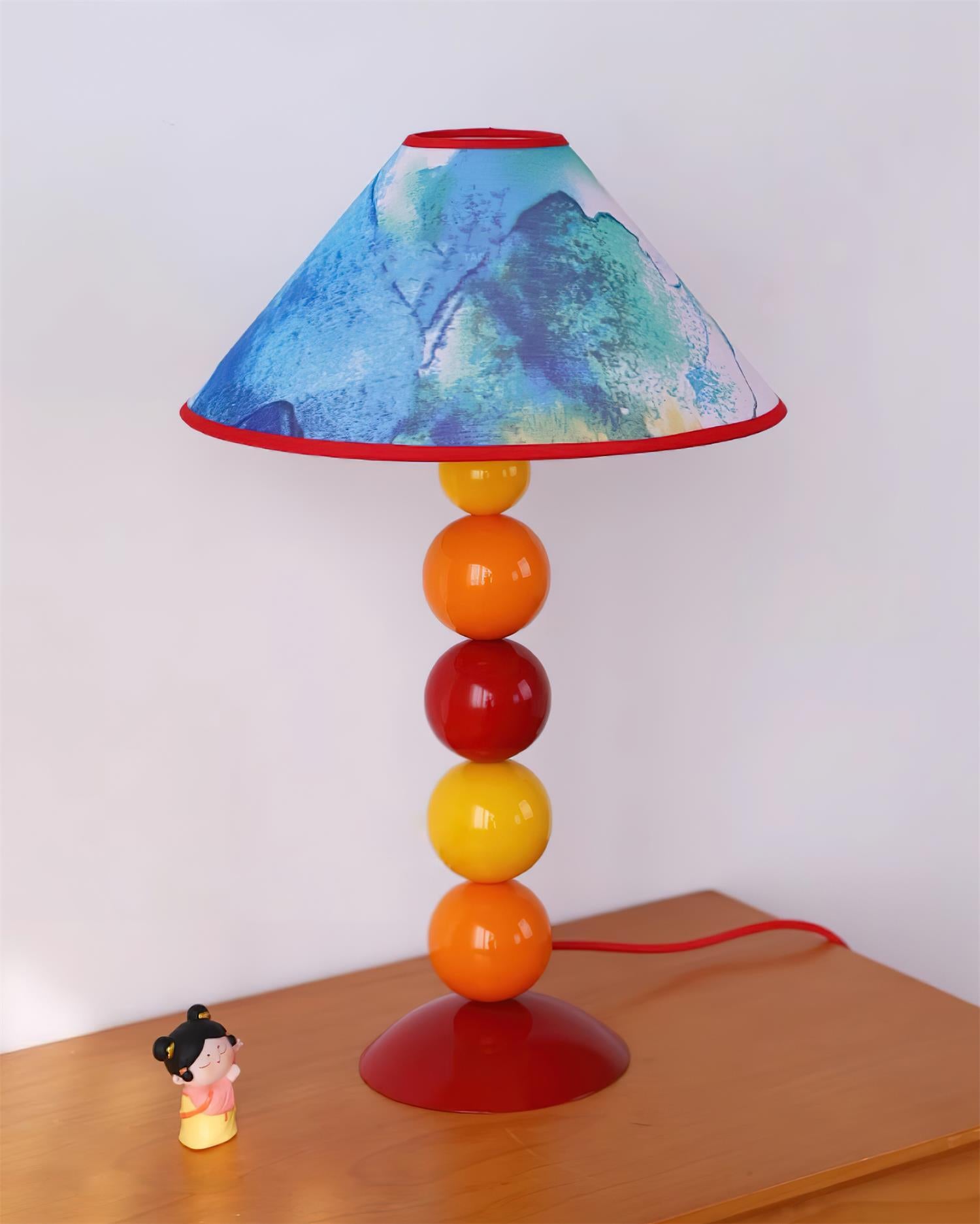 Contemporary table lamp with vibrant artistic color gradient and flowing design patterns - creative home lighting fixture