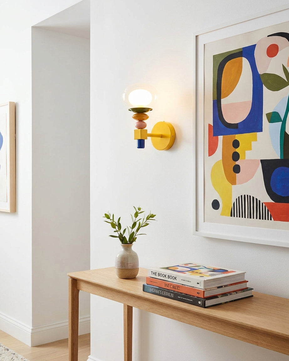 Popella wall sconce in modern hallway next to abstract art and wooden console table with plants