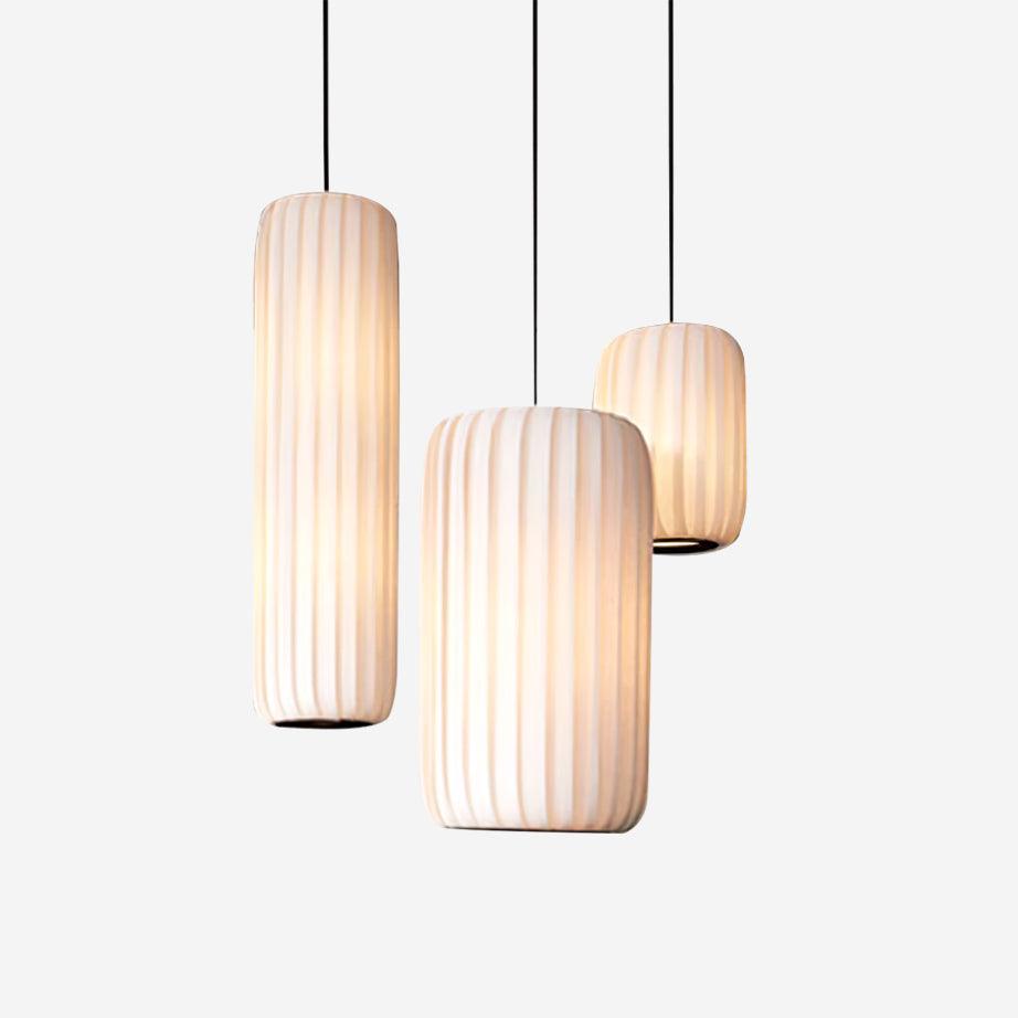 Minimalist white ribbed pendant light with fabric shade, modern Zen design aesthetic