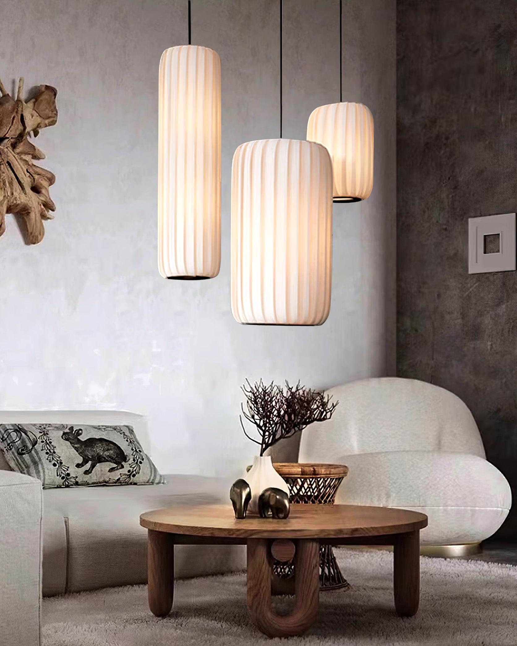 Rossau pendant light in bedroom setting with minimalist modern interior design