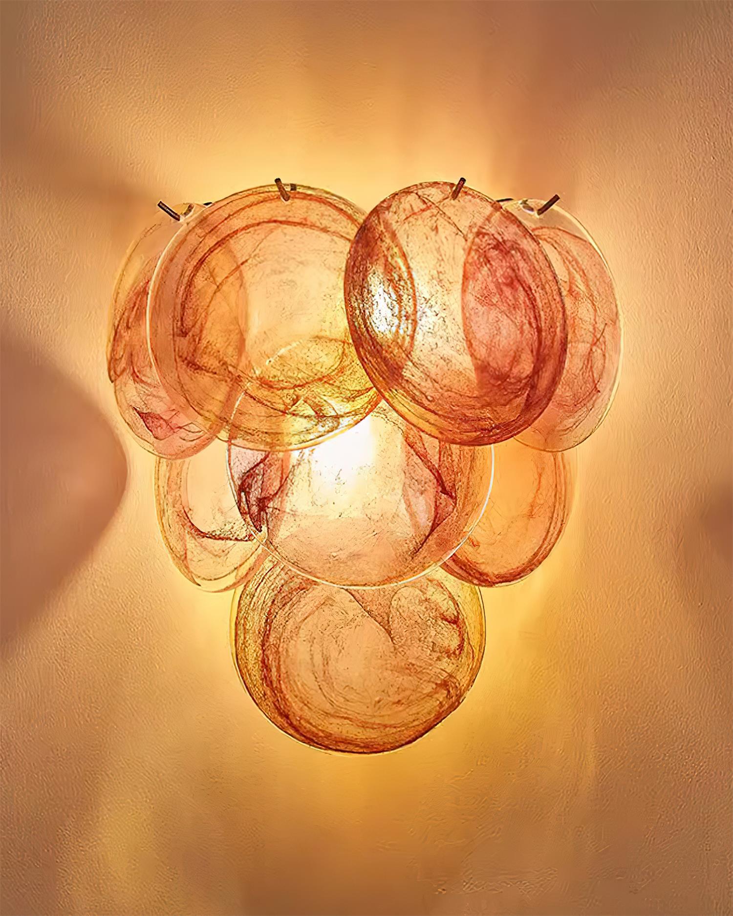 Talia hand-blown glass bubble wall sconce in green and pink color variations showing natural handmade character and authentic glass swirls