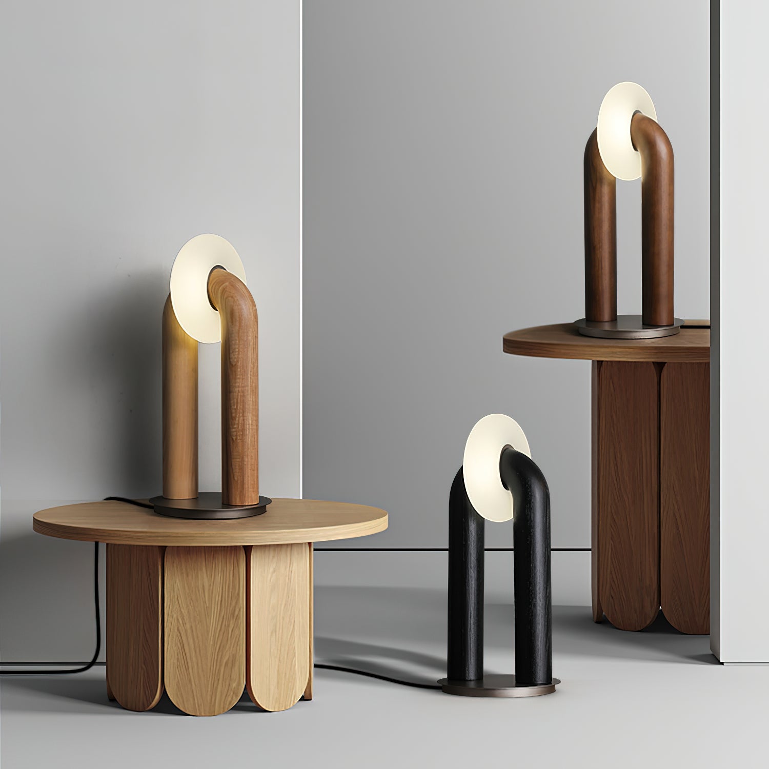 Pair of Teelo table lamps in walnut and matte black finishes on wooden side tables in modern home living room