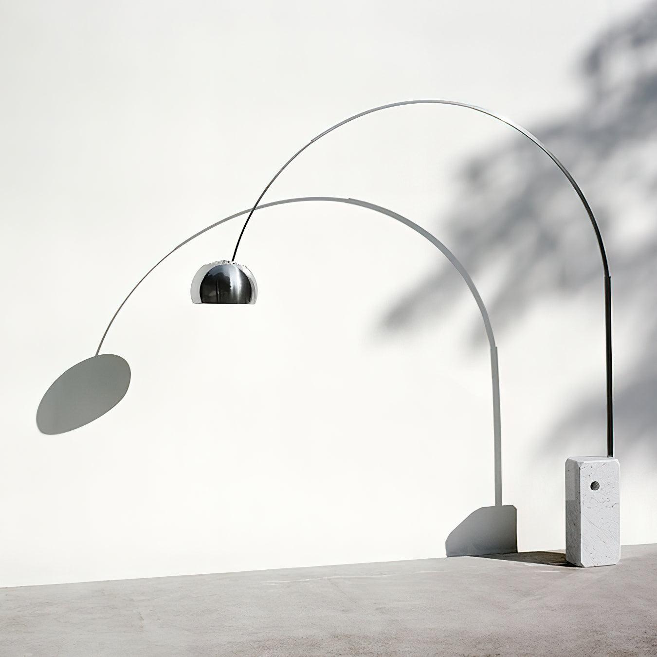 Arc floor lamp illuminated showing warm light diffusion and fabric shade quality