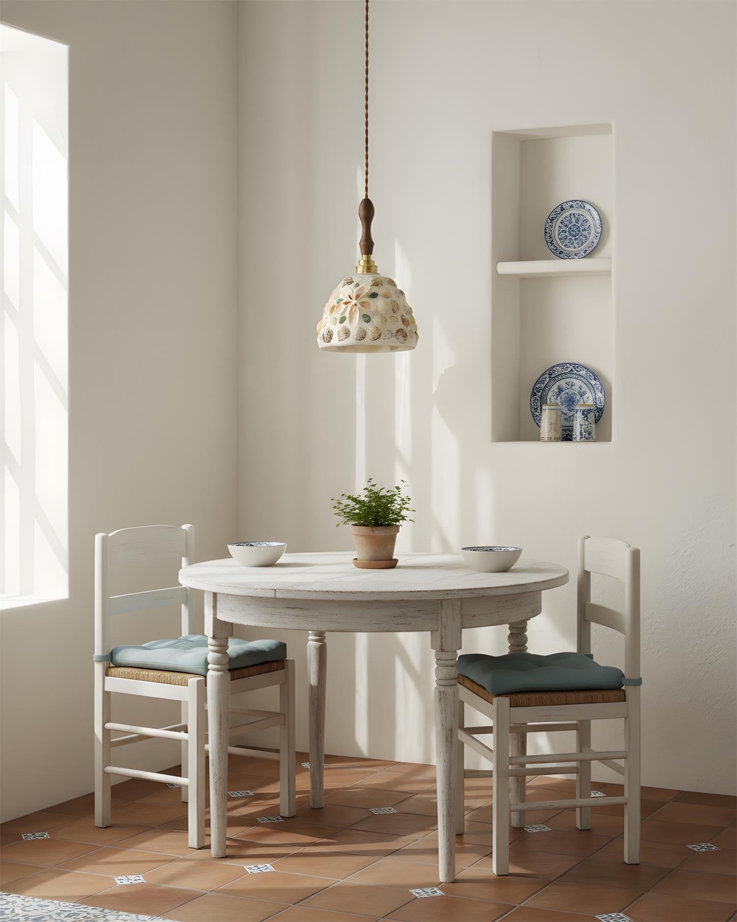 Tessaro white ceramic embossed pendant light in minimalist farmhouse dining nook setting