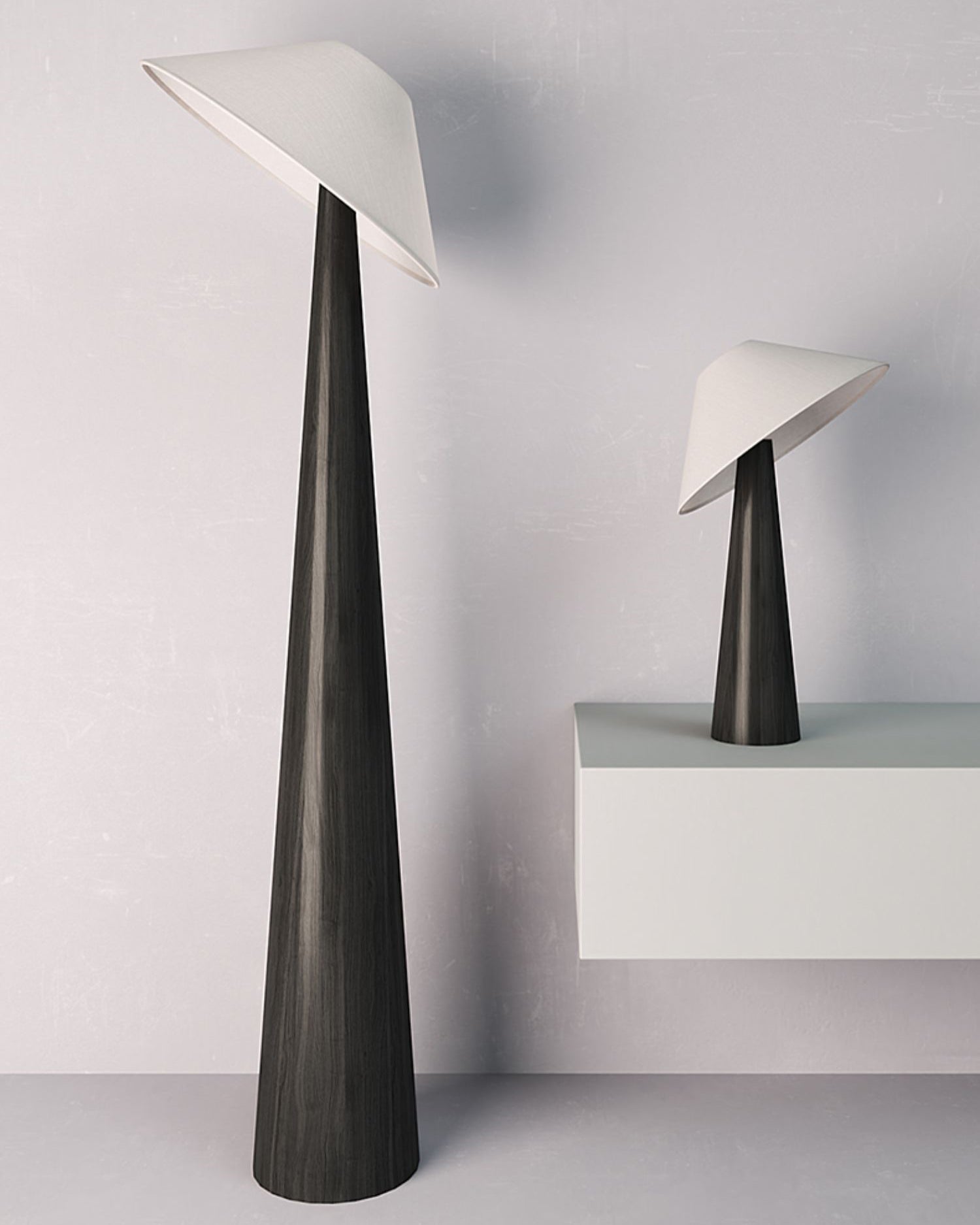 Modern black matte floor lamp with off-white angled shade and tapered pole design