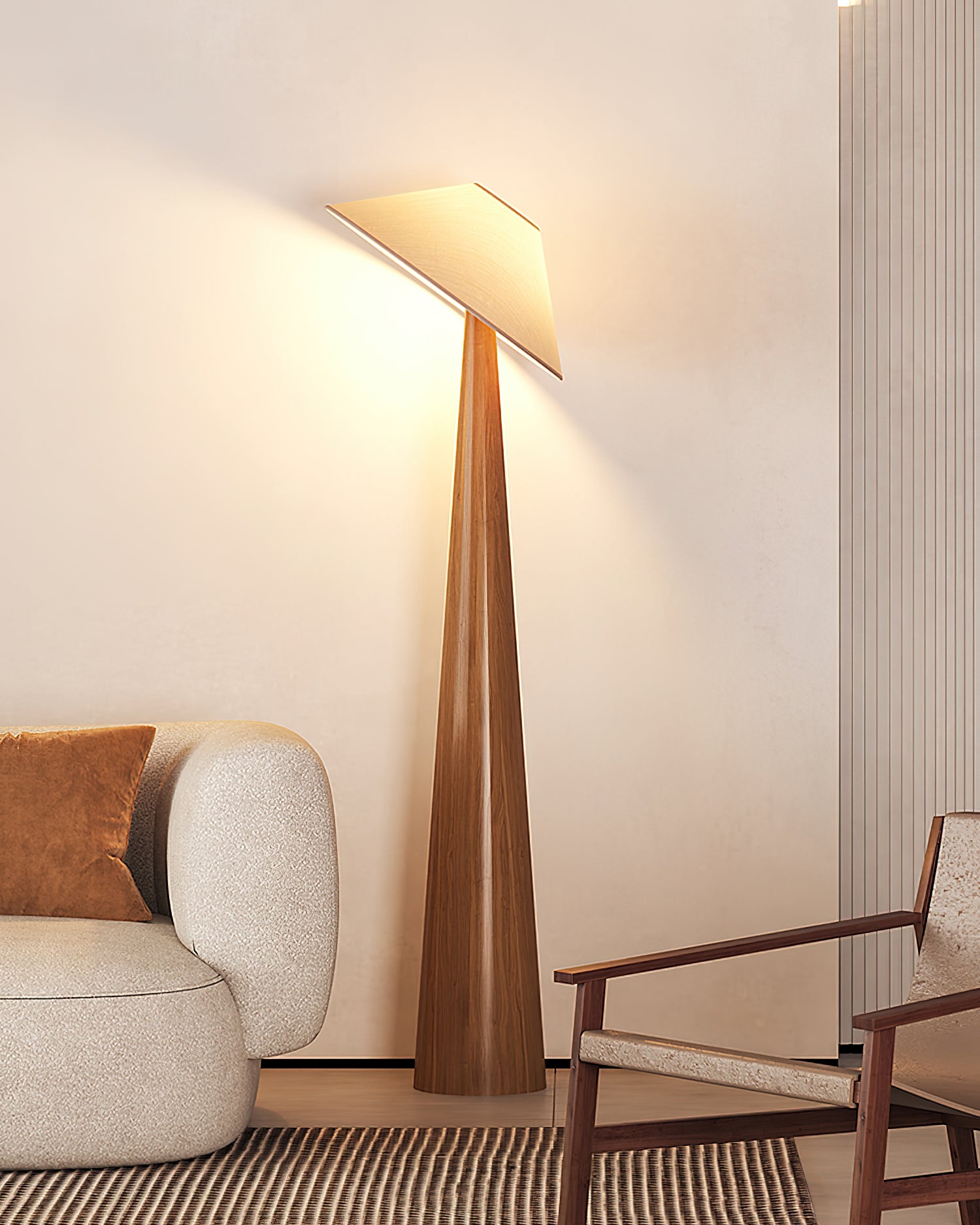 Natural wood tapered floor lamp with warm beige fabric shade in contemporary living space