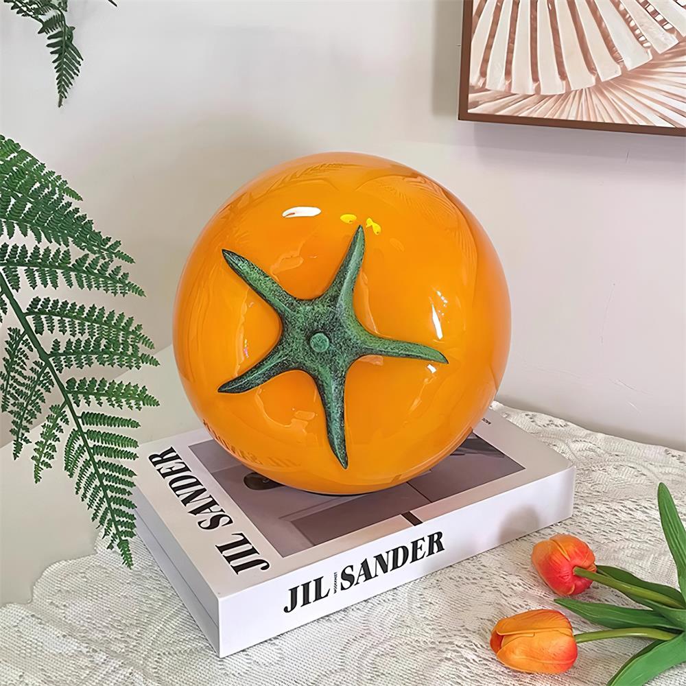 Orange tomato glass table lamp with spherical body and green calyx - handcrafted modern lighting