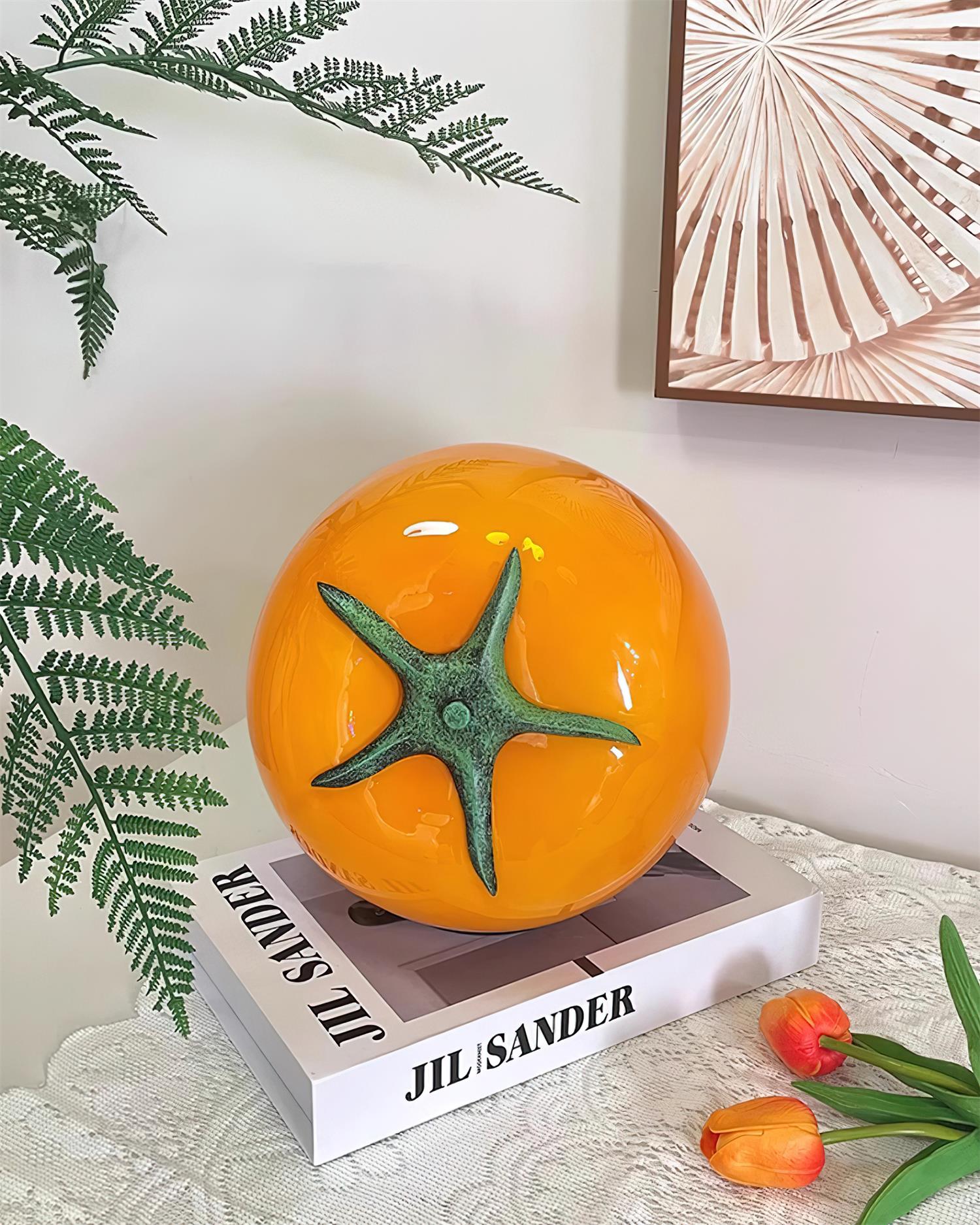 Orange tomato lamp on side table with wall art and ferns - contemporary home office lighting
