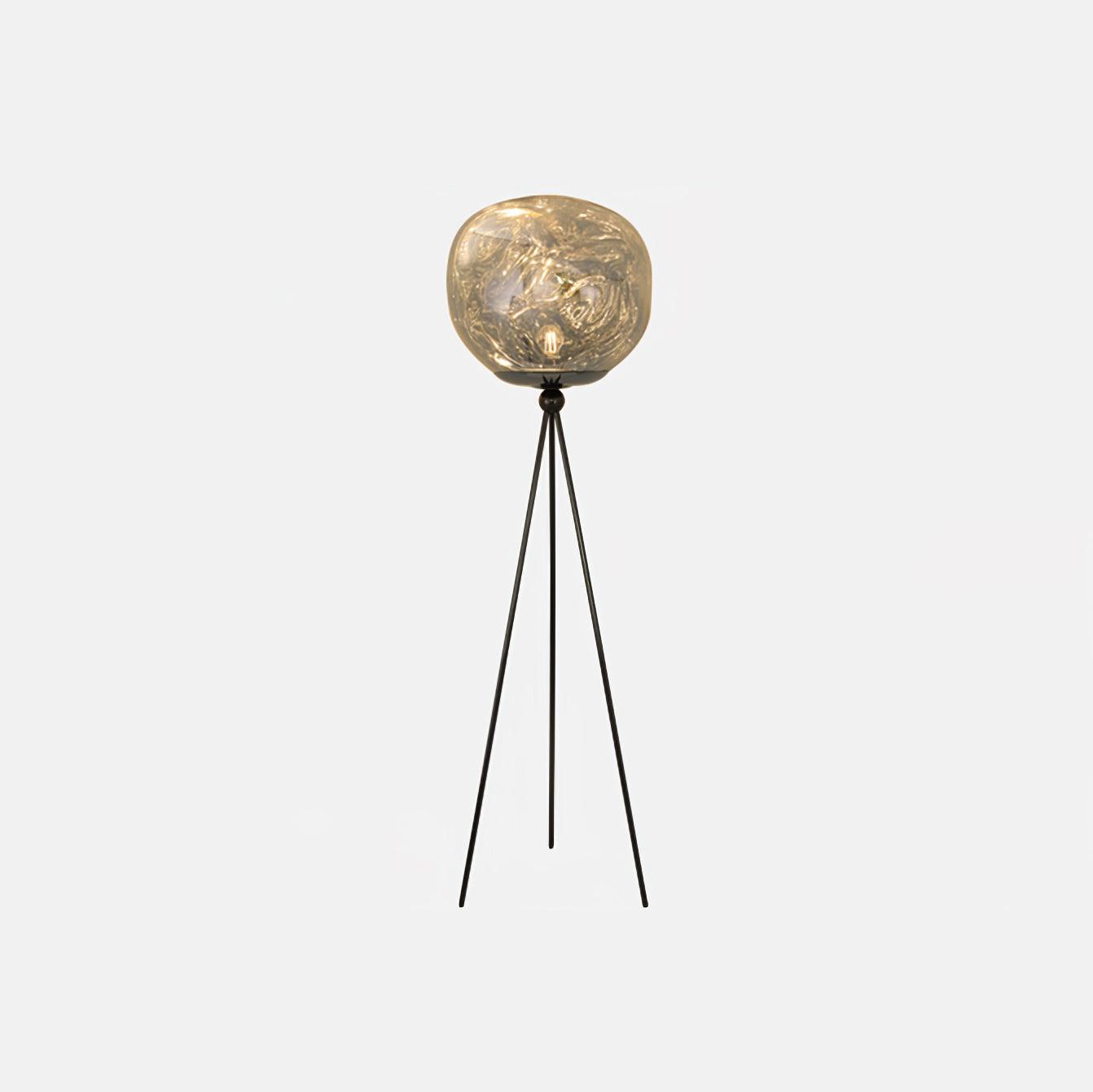 Modern artistic tripod floor lamp emphasizing unique molten lava glass craftsmanship and design detail
