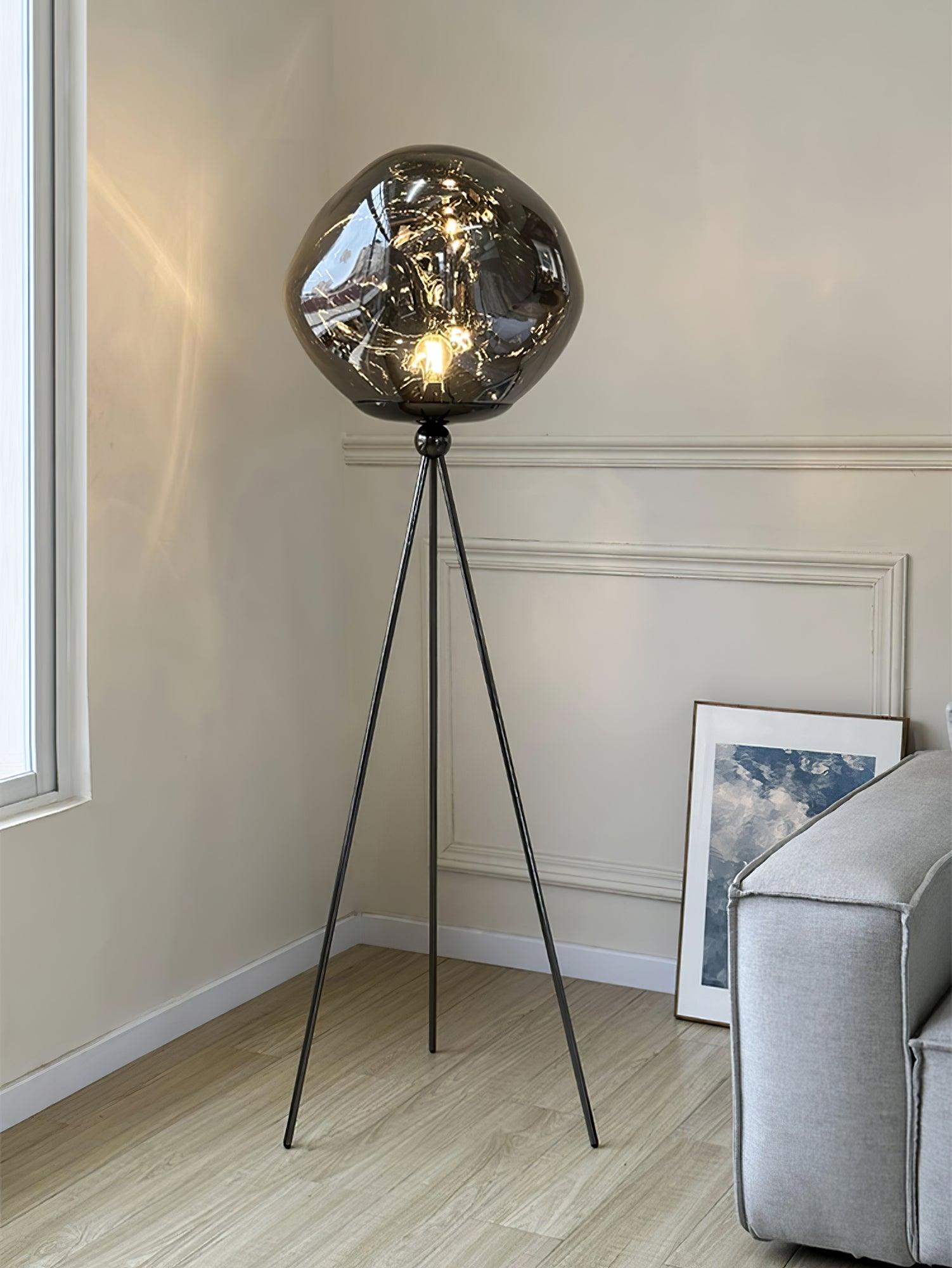 Modern tripod floor lamp with artistic molten glass and premium metal tripod frame in sophisticated finish