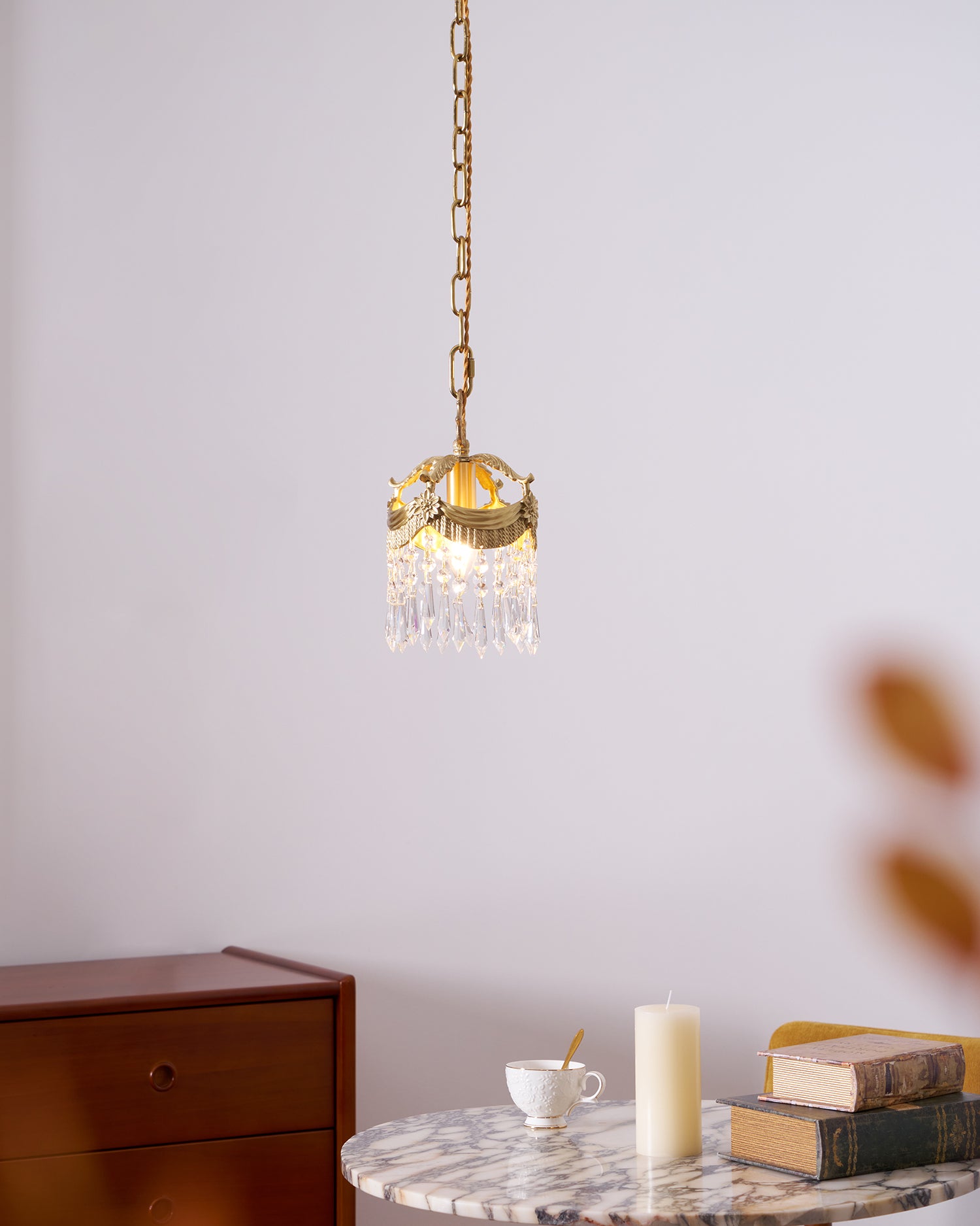 Vacarro crystal pendant chandelier in vintage dining corner with warm ambient lighting