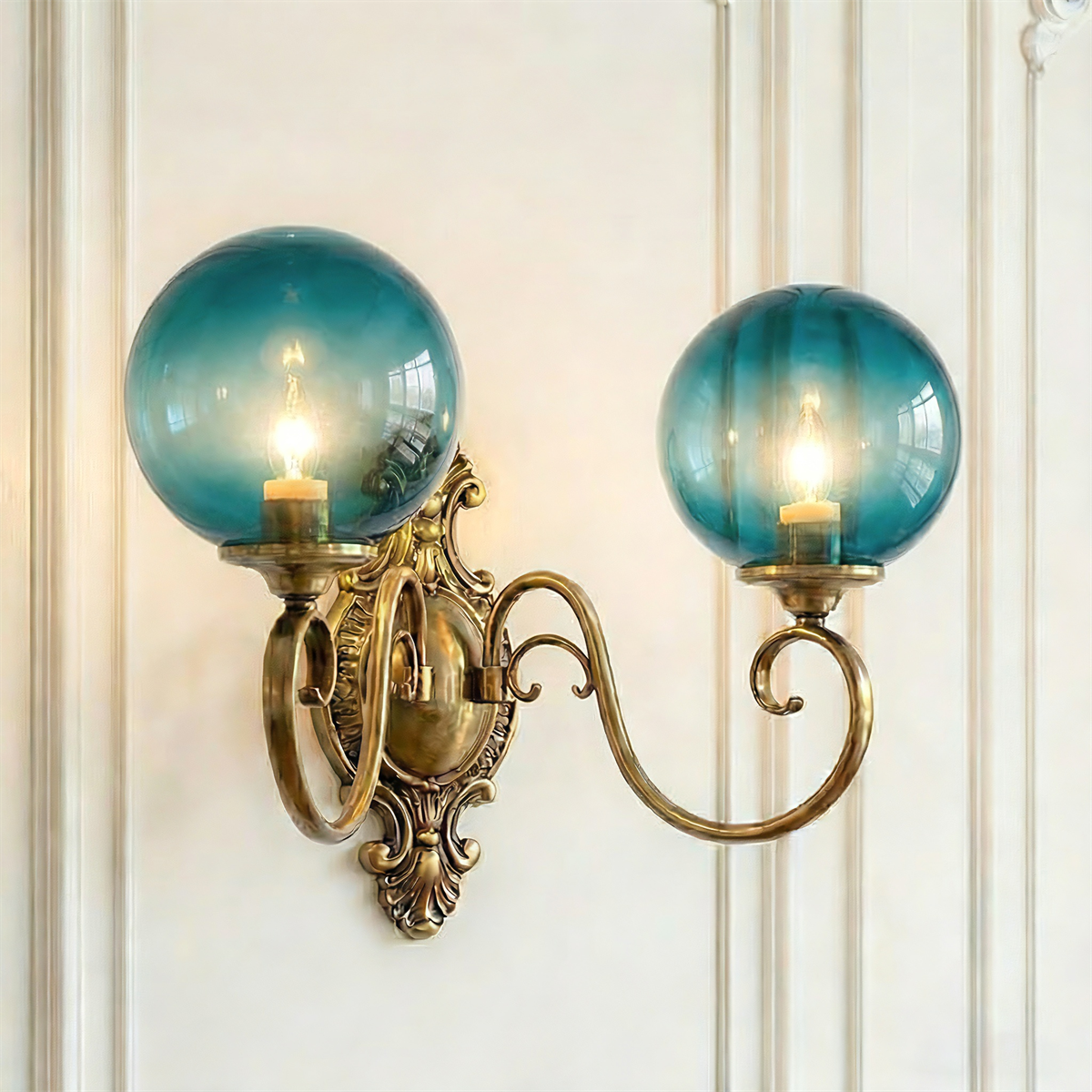 Dual-head ornate brass wall sconce with blue glass globes, vintage baroque wall lighting fixture