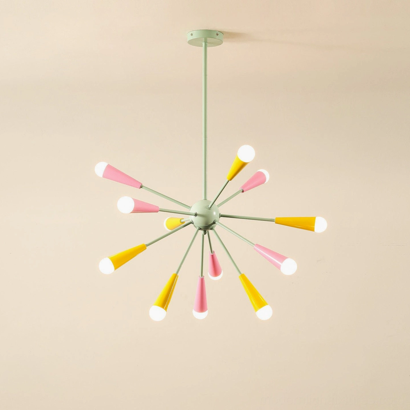 Compact 12-head sputnik chandelier with pastel green metal frame, pink and yellow tapered lamp shades, starburst silhouette on studio background