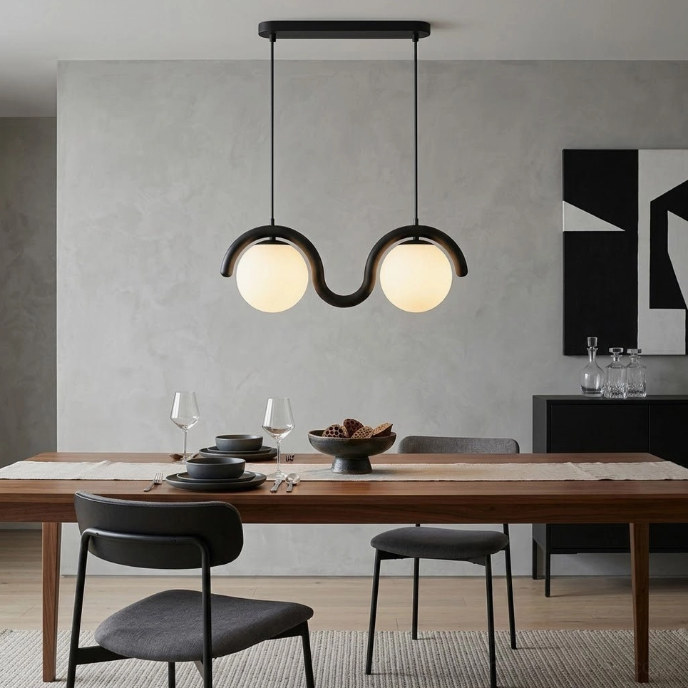 2-light black wave pendant lamp suspended over modern dining room table with frosted glass shades