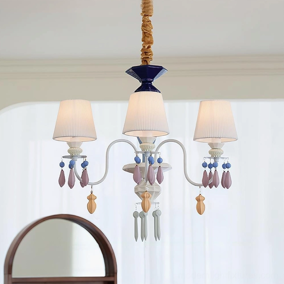 Compact 3-arm pastel ceramic chandelier with purple and brown decorative pendants in minimalist white space